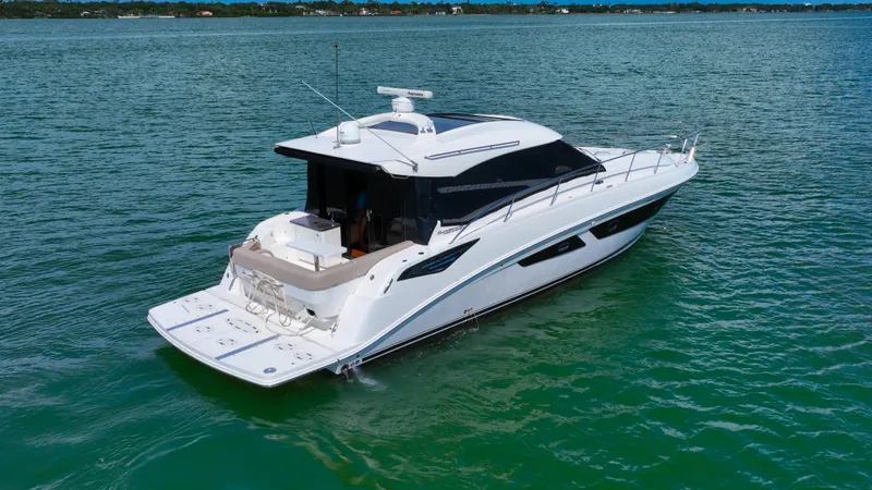 Just In Time Yacht Photos Pics 2016 Sea Ray 470 Sundancer yacht on calm water, showcasing sleek design and luxury features.