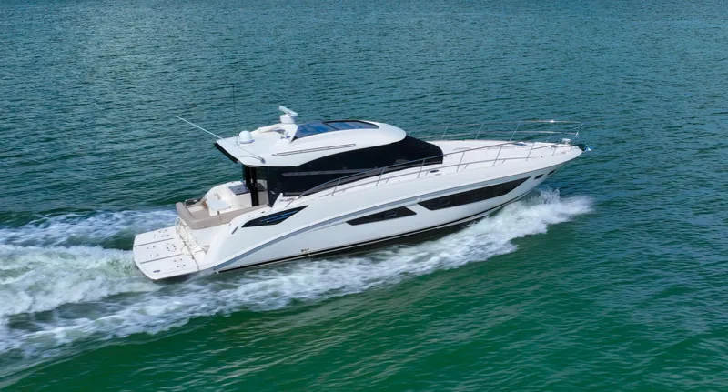 Just In Time Yacht Photos Pics 2016 Sea Ray 470 Sundancer cruising on open water, showcasing sleek design and luxury.