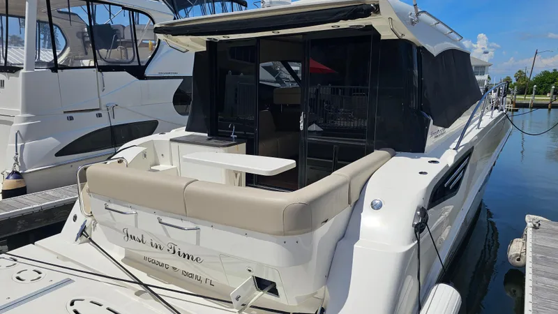 Just In Time Yacht Photos Pics 2016 Sea Ray 470 Sundancer yacht docked at marina, featuring spacious outdoor seating.