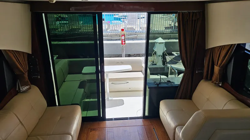 Just In Time Yacht Photos Pics Interior view of 2016 Sea Ray 470 Sundancer yacht with leather seating and glass doors.