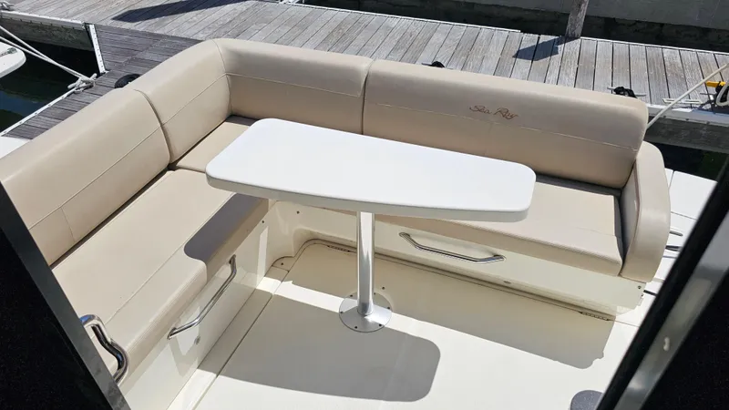 Just In Time Yacht Photos Pics Luxurious seating area on 2016 Sea Ray 470 Sundancer yacht with table.