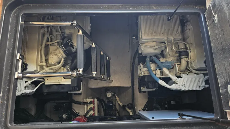 Just In Time Yacht Photos Pics Engine compartment of a 2016 Sea Ray 470 Sundancer boat, showcasing dual engines.