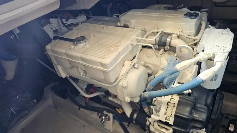 Just In Time Yacht Photos Pics Engine compartment of a 2016 Sea Ray 470 Sundancer boat, showcasing mechanical components.