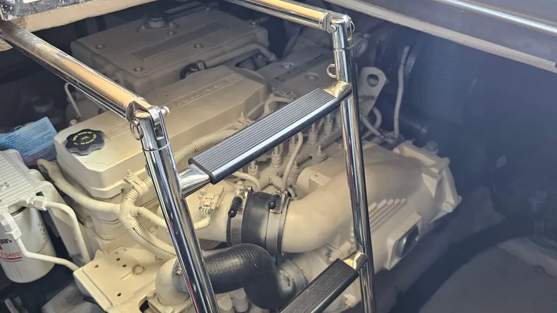 Just In Time Yacht Photos Pics Engine compartment of a 2016 Sea Ray 470 Sundancer with visible ladder and components.