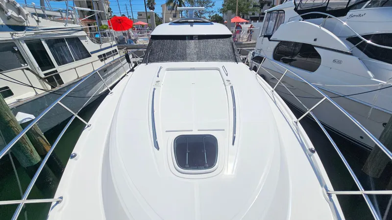 Just In Time Yacht Photos Pics 2016 Sea Ray 470 Sundancer yacht docked between boats.