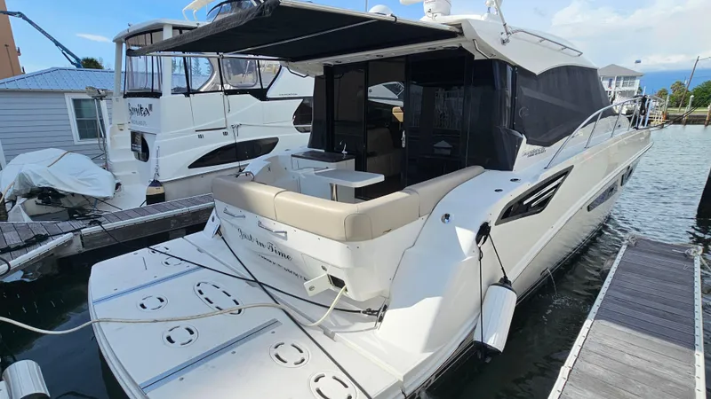 Just In Time Yacht Photos Pics 2016 Sea Ray 470 Sundancer yacht docked at marina, rear view.