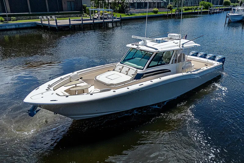  Yacht Photos Pics 2019 Grady-White Canyon 456 boat cruising on a calm river.