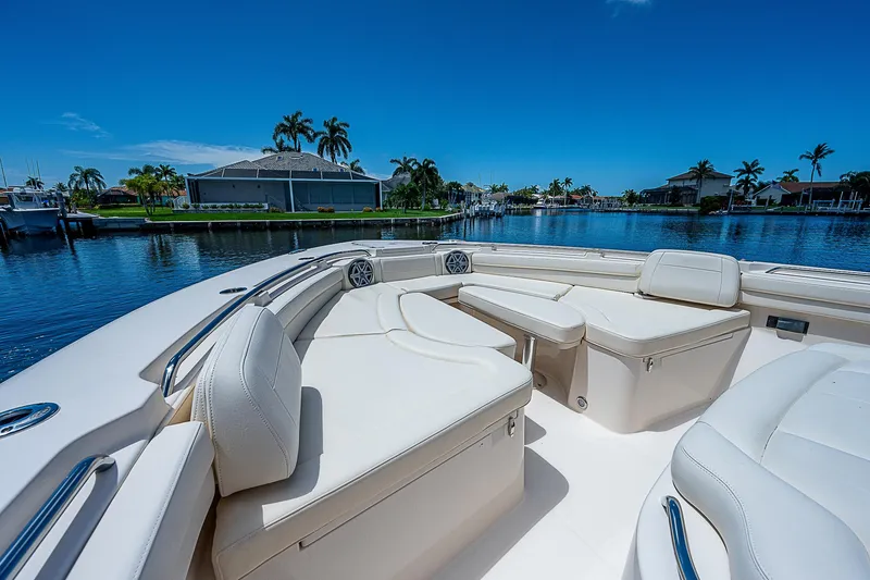  Yacht Photos Pics 2019 Grady-White Canyon 456 boat with luxurious seating on a sunny day.