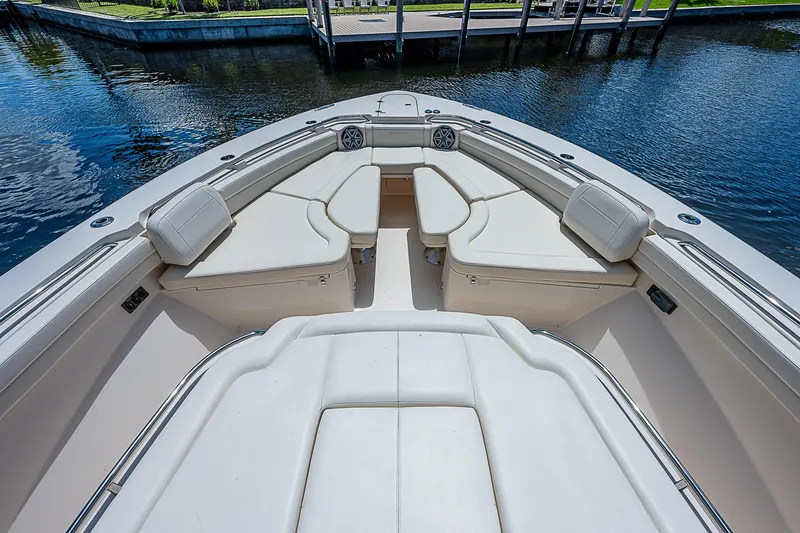  Yacht Photos Pics 2019 Grady-White Canyon 456 boat with spacious seating area on the water.