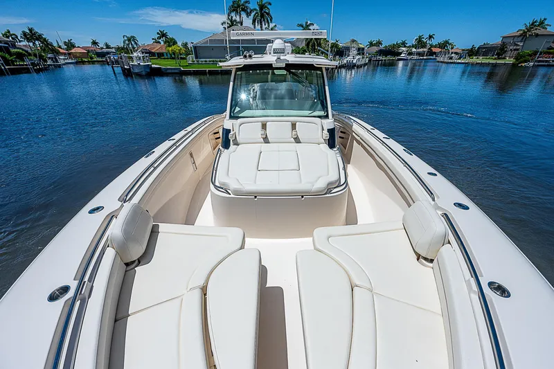  Yacht Photos Pics 2019 Grady-White Canyon 456 boat on a sunny day in a marina.
