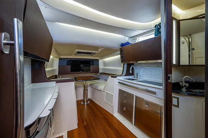  Yacht Photos Pics 2019 Grady-White Canyon 456 interior cabin with modern amenities and wood flooring.