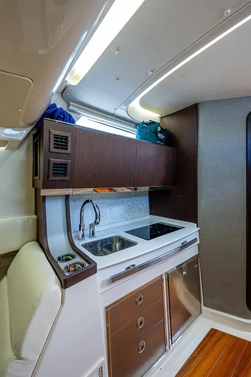  Yacht Photos Pics 2019 Grady-White Canyon 456 boat interior kitchen with sink and stove.