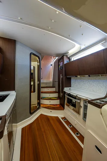  Yacht Photos Pics Interior of 2019 Grady-White Canyon 456 boat with modern kitchen and wooden flooring.