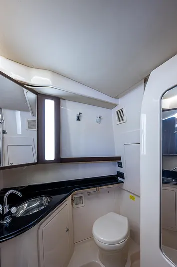  Yacht Photos Pics 2019 Grady-White Canyon 456 boat bathroom with modern fixtures and sleek design.
