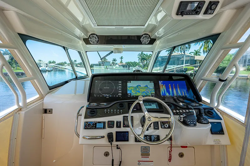  Yacht Photos Pics 2019 Grady-White Canyon 456 helm with advanced navigation system and waterfront view.