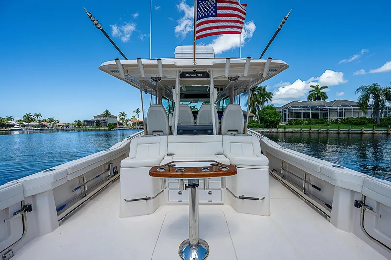  Yacht Photos Pics 2019 Grady-White Canyon 456 boat with luxurious seating and American flag.