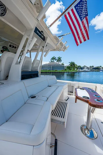  Yacht Photos Pics 2019 Grady-White Canyon 456 boat with luxurious seating and American flag.