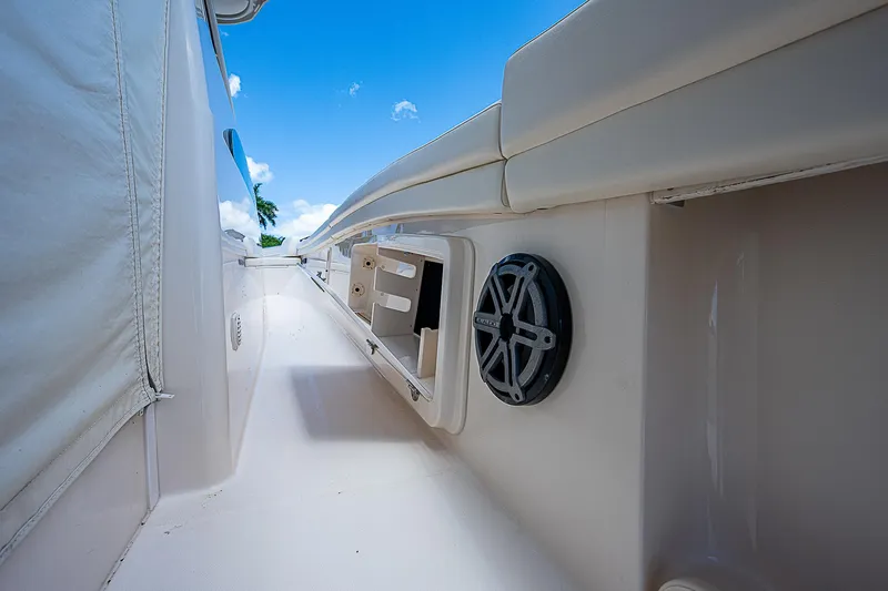  Yacht Photos Pics 2019 Grady-White Canyon 456 boat deck with speaker and storage compartments.