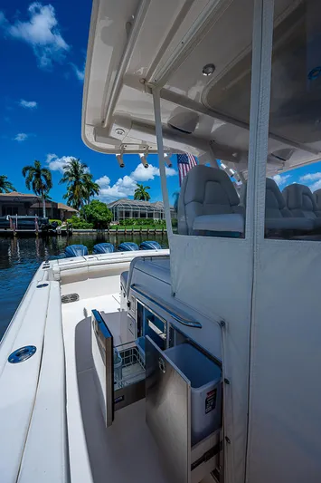  Yacht Photos Pics 2019 Grady-White Canyon 456 boat interior with seating and storage compartments.