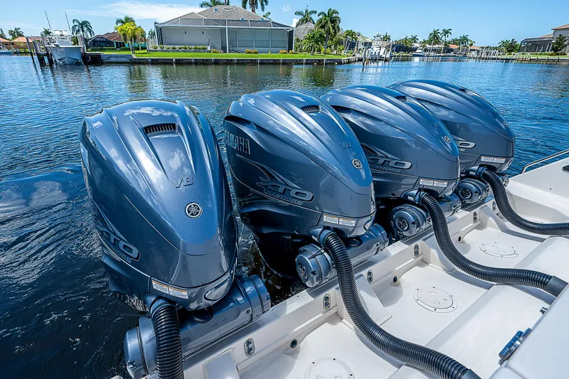  Yacht Photos Pics 2019 Grady-White Canyon 456 with quad Yamaha outboard engines on water.
