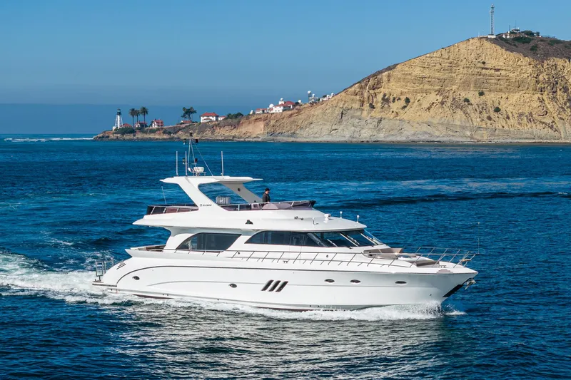  Yacht Photos Pics 2023 Massimo Marine 72' Flybridge Motor Yacht cruising near scenic coastline.