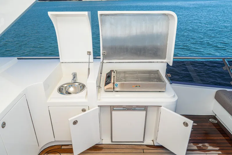  Yacht Photos Pics Outdoor kitchen on 2023 Massimo Marine 72' Flybridge Yacht with sink and grill.