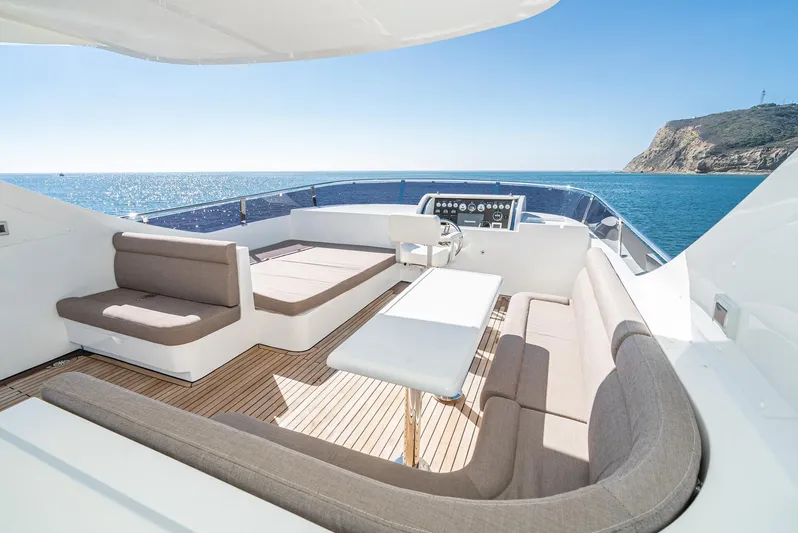  Yacht Photos Pics Luxurious 2023 Massimo Marine 72' Flybridge Motor Yacht with spacious seating and ocean view.