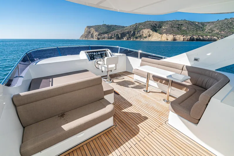  Yacht Photos Pics Luxurious 2023 Massimo Marine 72' Flybridge Motor Yacht with spacious deck and stunning ocean view.