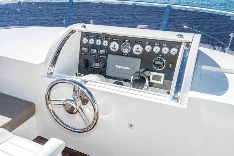  Yacht Photos Pics 2023 Massimo Marine 72' Flybridge Motor Yacht helm with advanced navigation controls.