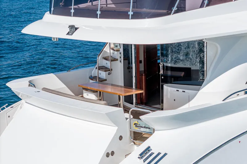  Yacht Photos Pics 2023 Massimo Marine 72' Flybridge Motor Yacht, elegant deck view with seating and stairs.