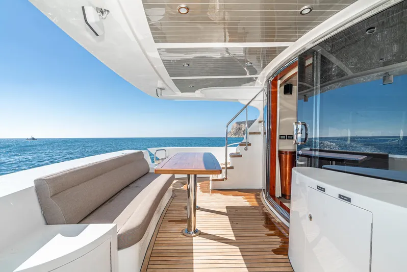  Yacht Photos Pics Luxurious 2023 Massimo Marine 72' Flybridge Motor Yacht with elegant deck seating and ocean view.
