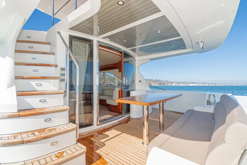  Yacht Photos Pics Luxurious 2023 Massimo Marine 72' Flybridge Motor Yacht with elegant outdoor seating and ocean view.