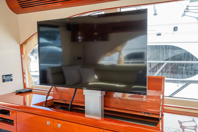  Yacht Photos Pics Luxurious interior of 2023 Massimo Marine 72' Flybridge Motor Yacht with sleek TV setup.