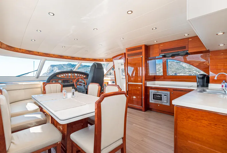  Yacht Photos Pics Luxurious interior of 2023 Massimo Marine 72' Flybridge Motor Yacht with elegant dining area.