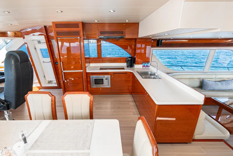  Yacht Photos Pics Luxurious interior of 2023 Massimo Marine 72' Flybridge Motor Yacht with modern kitchen and dining area.