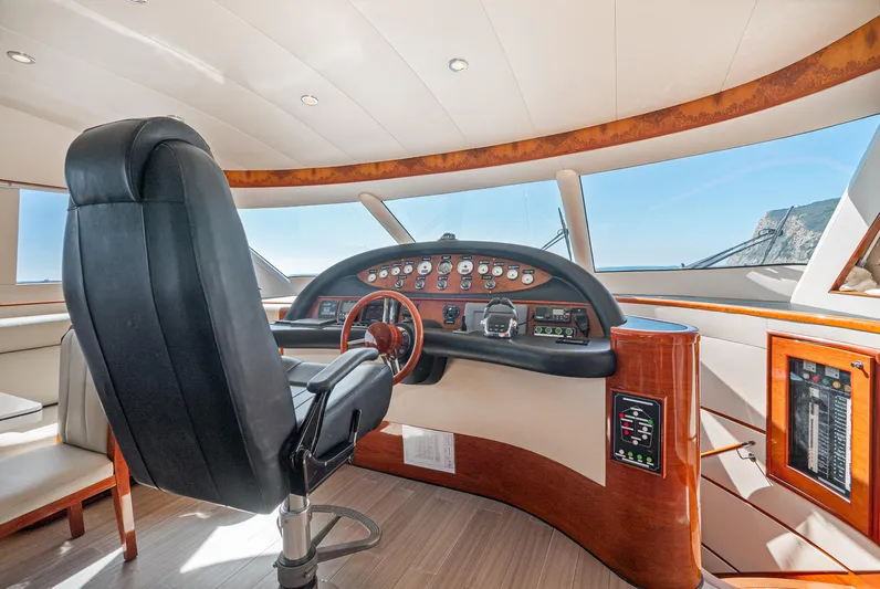  Yacht Photos Pics Luxurious helm of 2023 Massimo Marine 72' Flybridge Motor Yacht with modern controls.