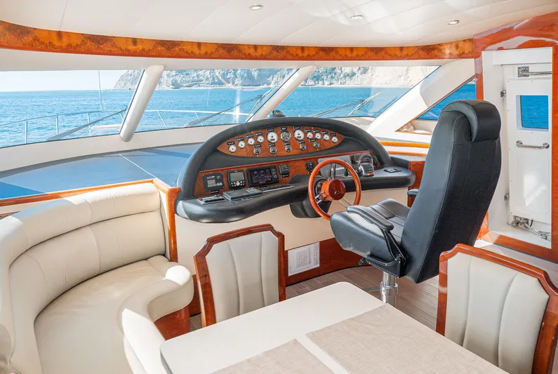  Yacht Photos Pics Luxurious 2023 Massimo Marine 72' Flybridge Motor Yacht interior with elegant helm and seating.