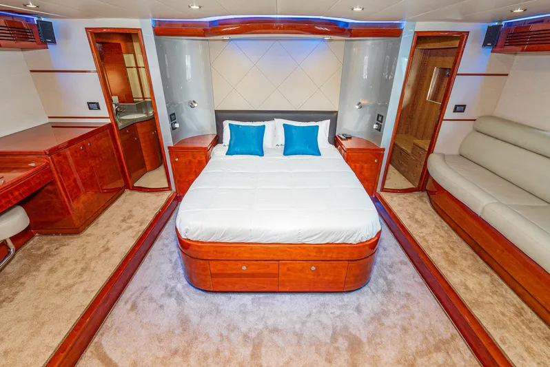  Yacht Photos Pics Luxurious bedroom in 2023 Massimo Marine 72' Flybridge Motor Yacht with elegant wood finishes.
