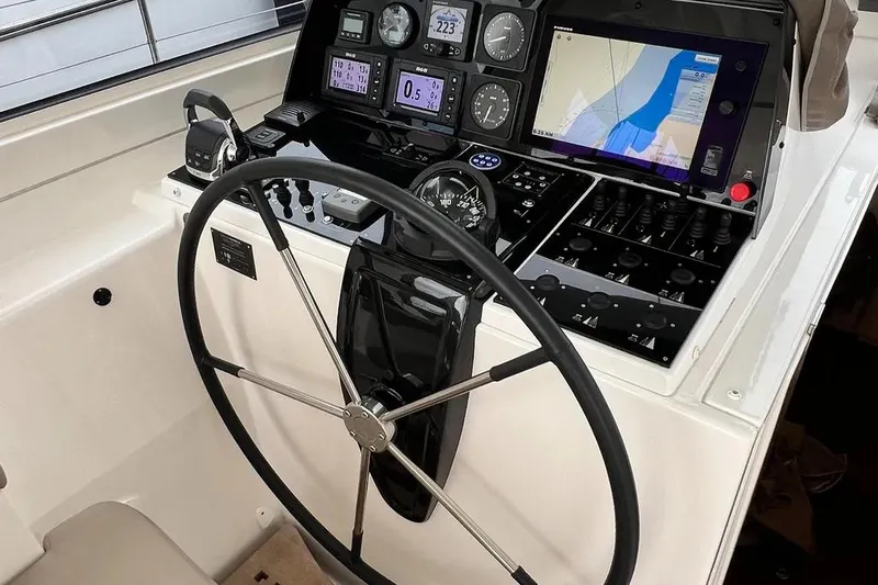  Yacht Photos Pics Steering wheel and navigation controls on a 2016 Amel 64 yacht.