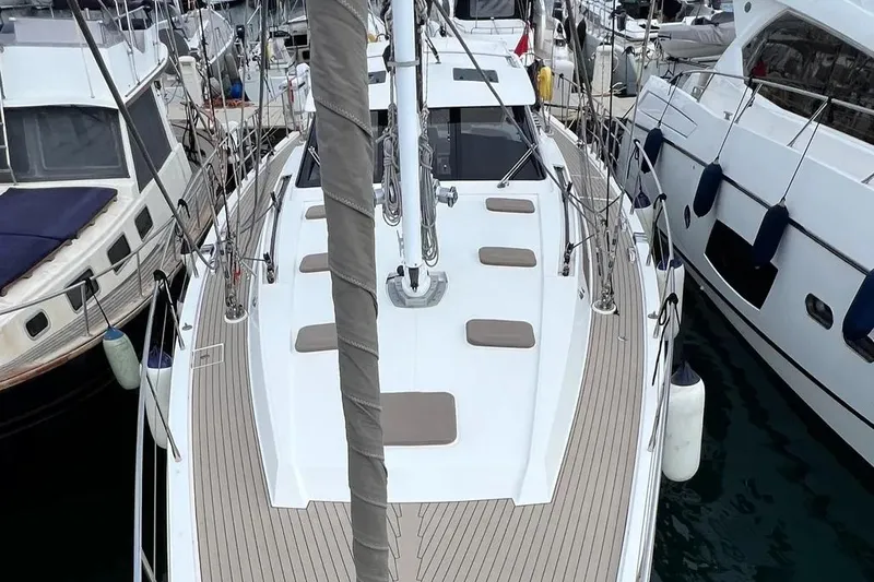  Yacht Photos Pics Sailboat Amel 64, 2016 model, docked among other boats in a marina.