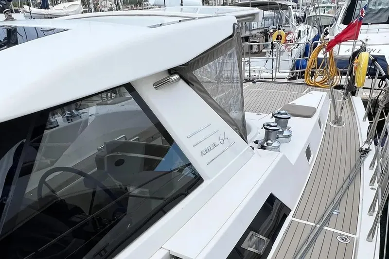  Yacht Photos Pics Sleek 2016 Amel 64 yacht docked, showcasing modern design and spacious deck.