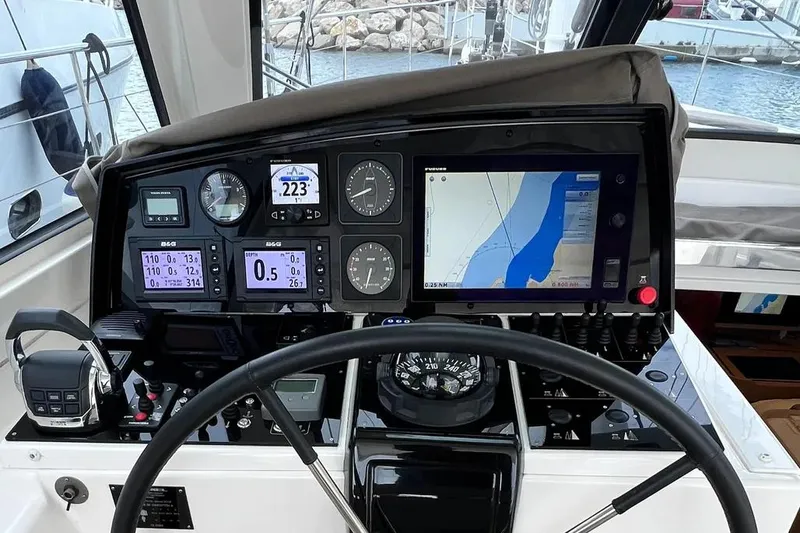  Yacht Photos Pics Cockpit of 2016 Amel 64 yacht with navigation instruments and digital displays.