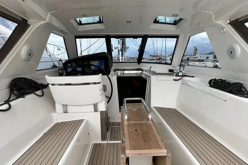  Yacht Photos Pics Interior of a 2016 Amel 64 yacht, featuring seating and navigation area.