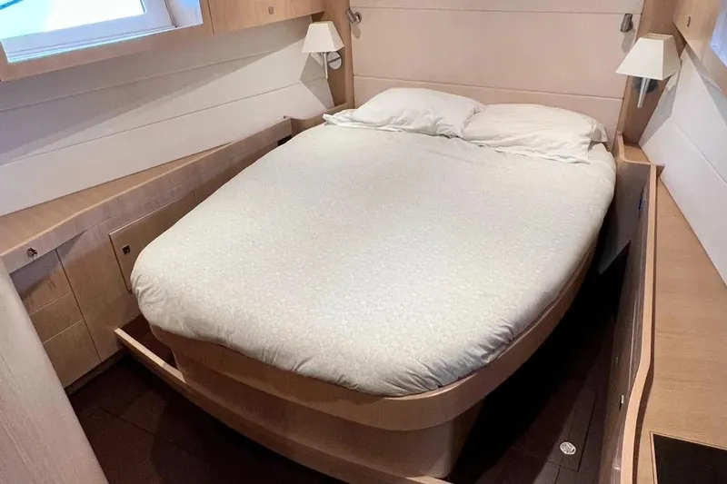  Yacht Photos Pics Cozy bedroom in 2016 Amel 64 yacht with modern wooden furnishings.