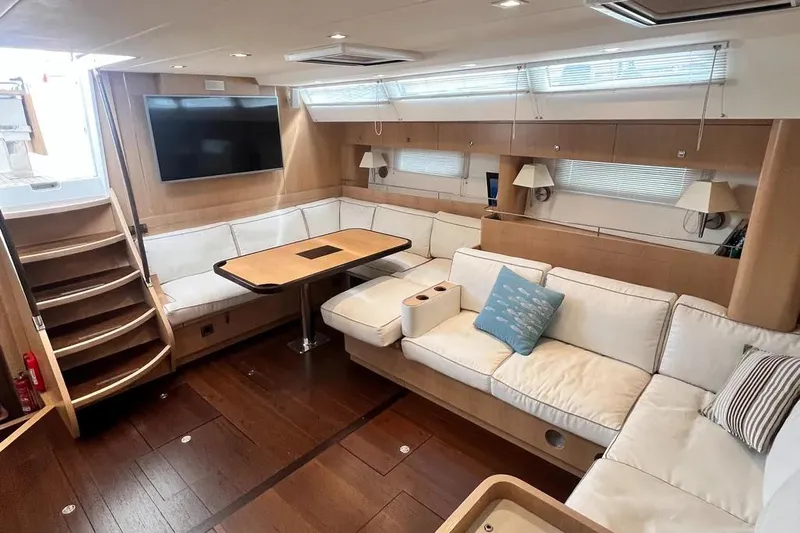  Yacht Photos Pics Luxurious interior of a 2016 Amel 64 yacht with modern seating and entertainment area.