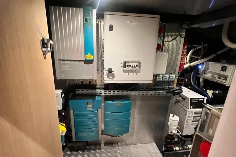  Yacht Photos Pics Electrical control room of a 2016 Amel 64 yacht, featuring various equipment and panels.