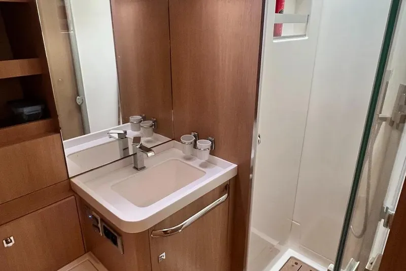  Yacht Photos Pics Modern bathroom interior on 2016 Amel 64 yacht, featuring sink and shower.