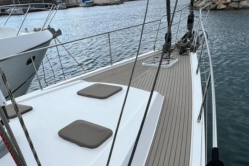  Yacht Photos Pics Amel 64 yacht deck, 2016 model, docked in a marina with calm waters.