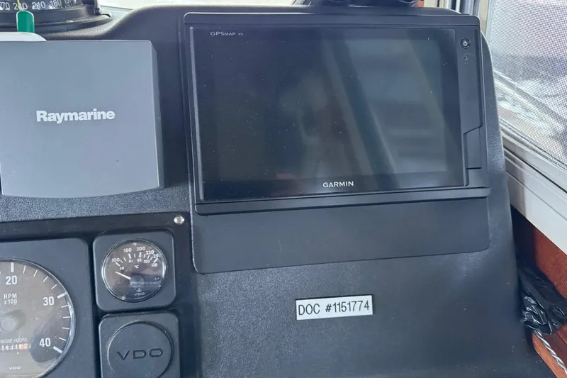 William B Yacht Photos Pics Control panel of a 2003 American Tug 34 with Garmin and Raymarine displays.