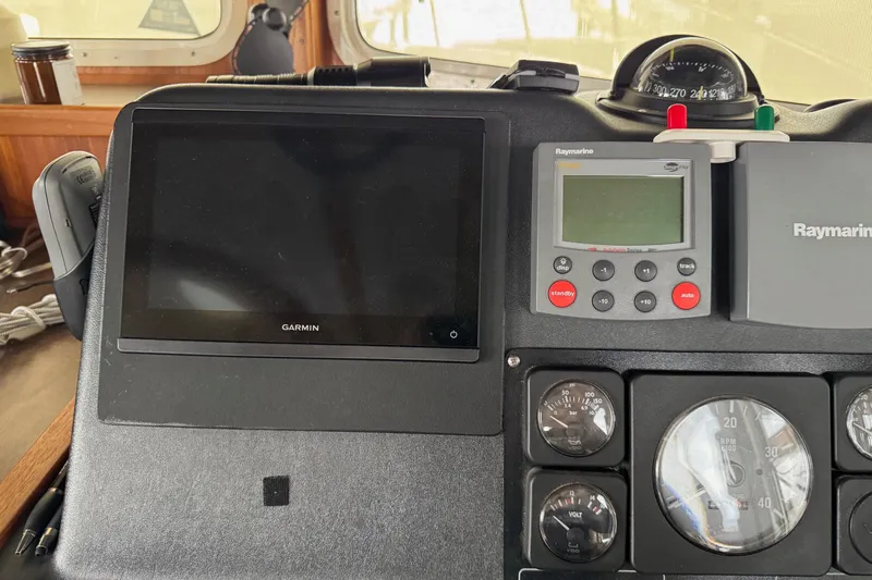 William B Yacht Photos Pics Control panel of a 2003 American Tug 34 with Garmin and Raymarine displays.